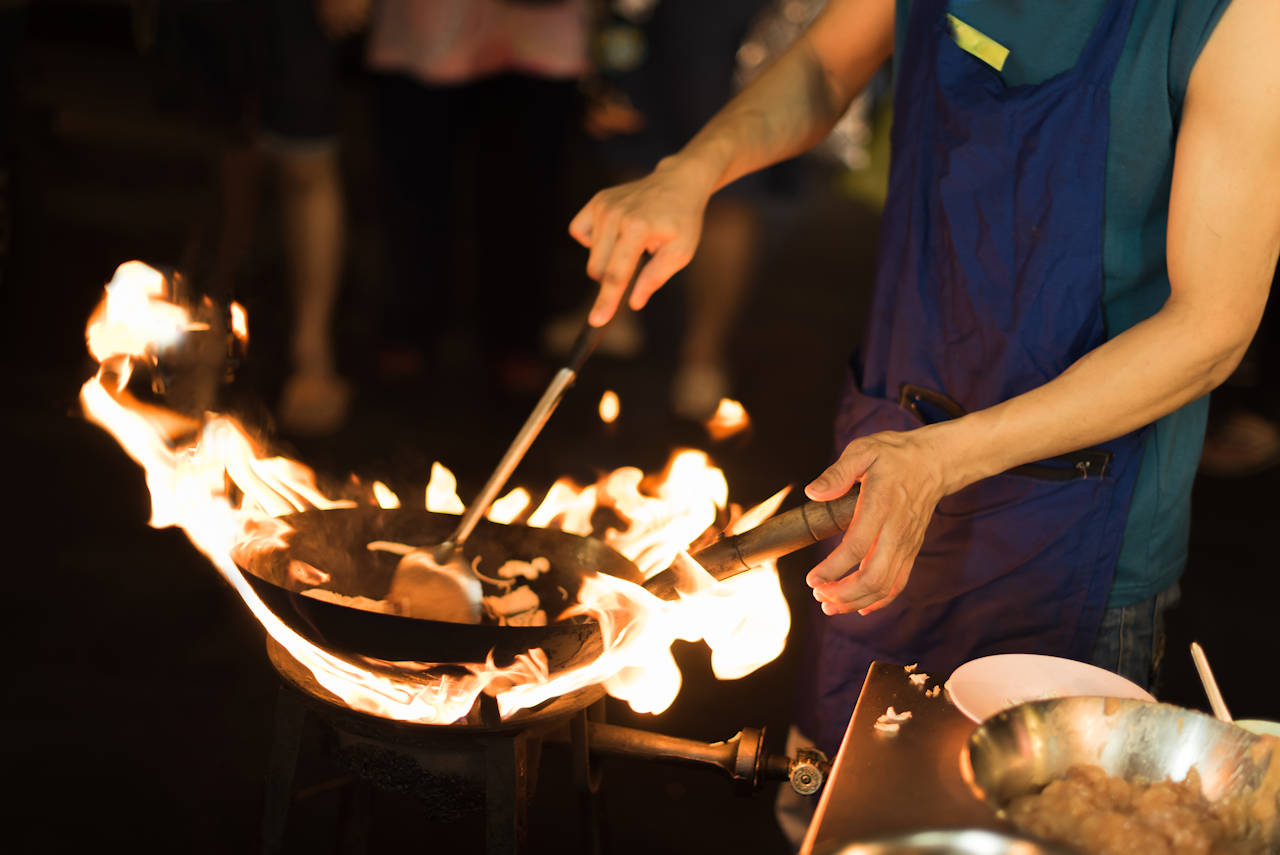 1280 The chef cooking Pad Thai in a pan at street chinatown shutterstock 563318812