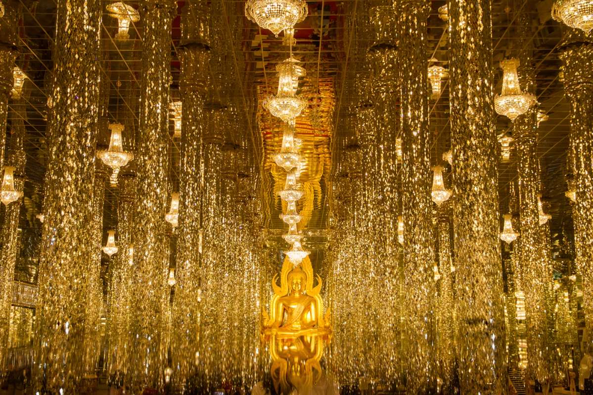 800 Golden Buddha statue in cathedral glass at the Wat Tha Sung Temple near Uthai Thani shutterstock 543355336