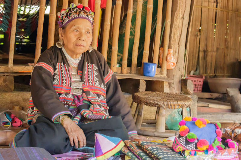 800 traditional of thai old woman selling souvenirs at Chiangmai shutterstock 531098482