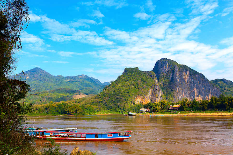 Web 900 Tour boats in Mekong river Luang Prabang shutterstock 1042859857
