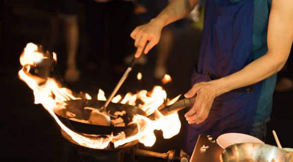 1280 The chef cooking Pad Thai in a pan at street chinatown shutterstock 563318812